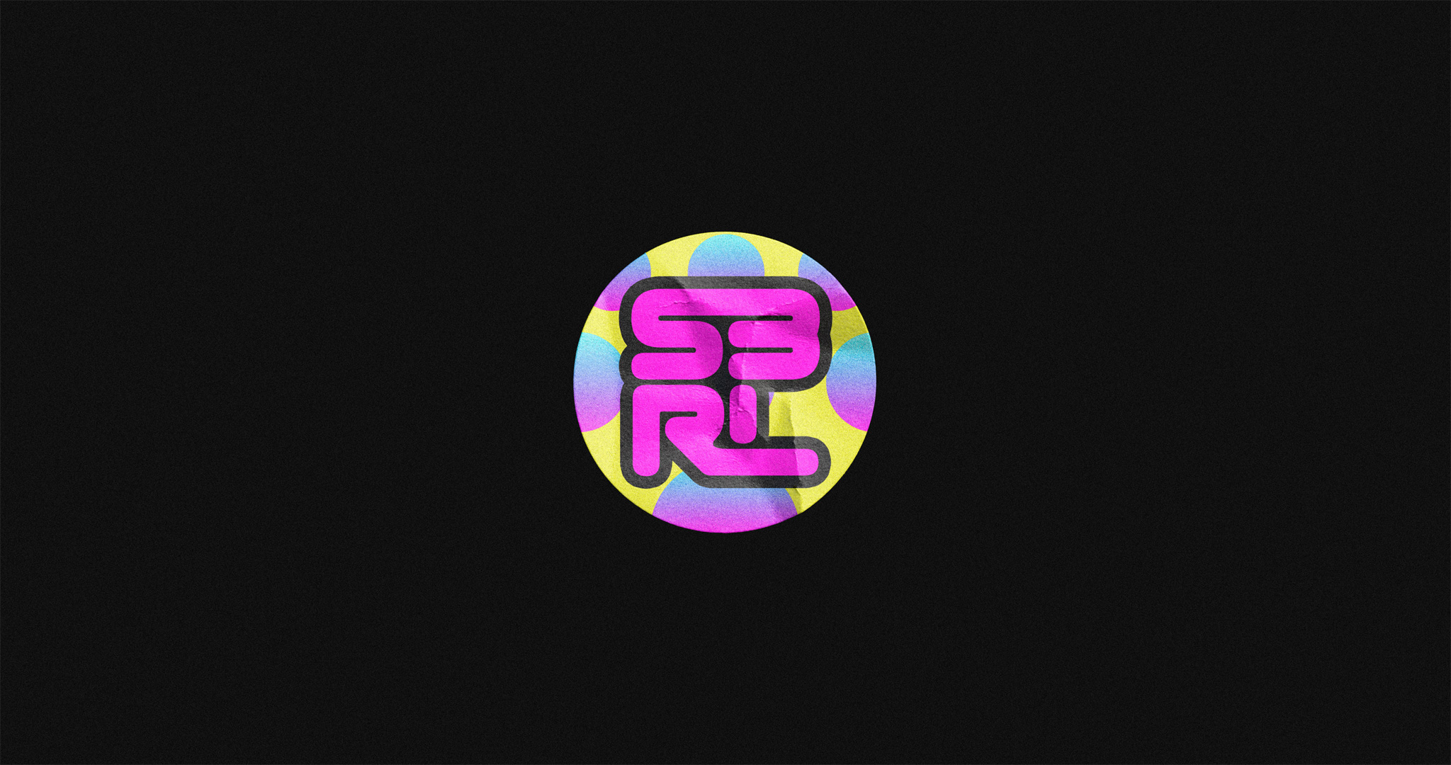 Compact, square version of the S3RL logotype, on a brightly colored, circular sticker.